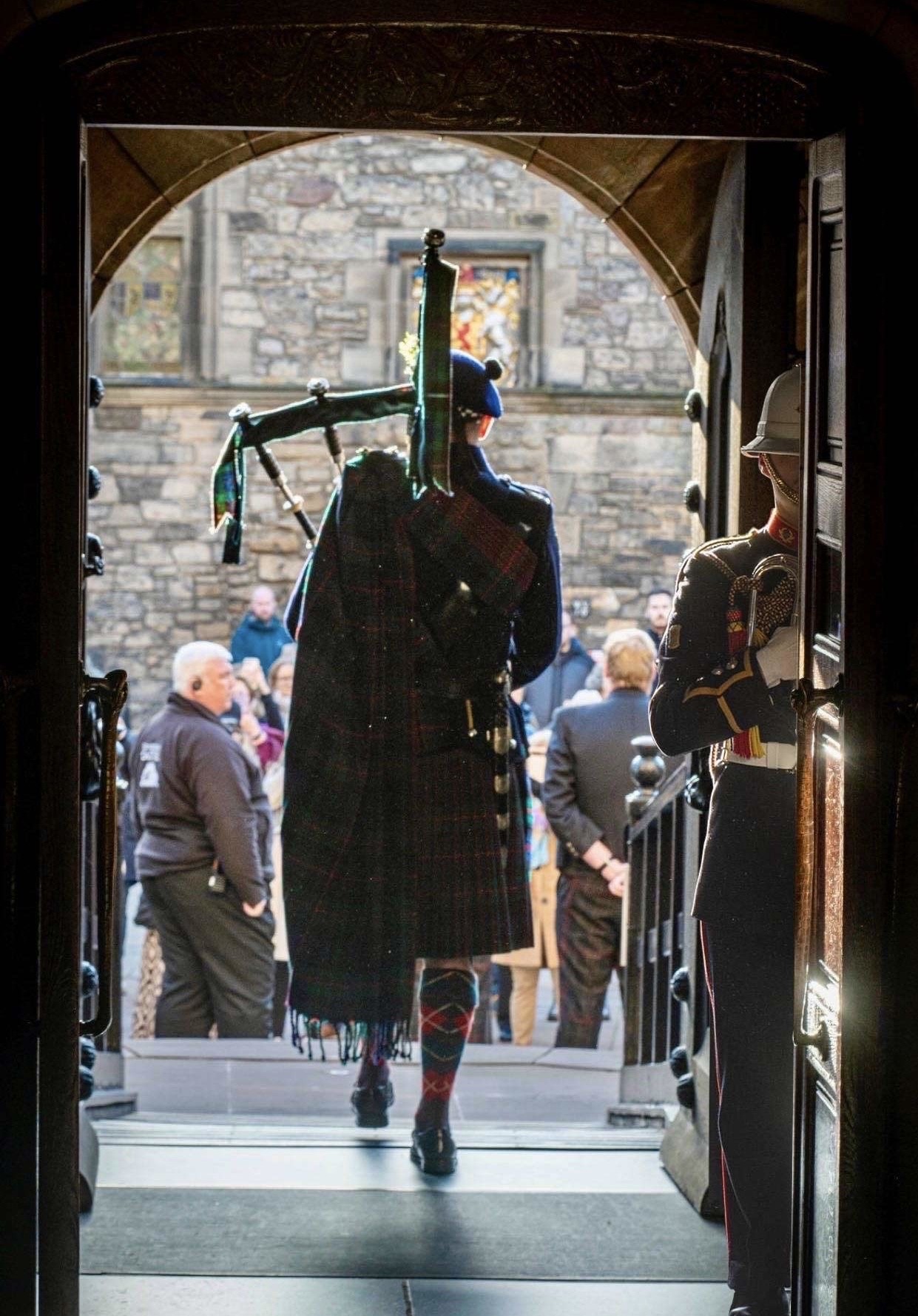 Felix Walker walking through arched doorway at Edinburgh Castle