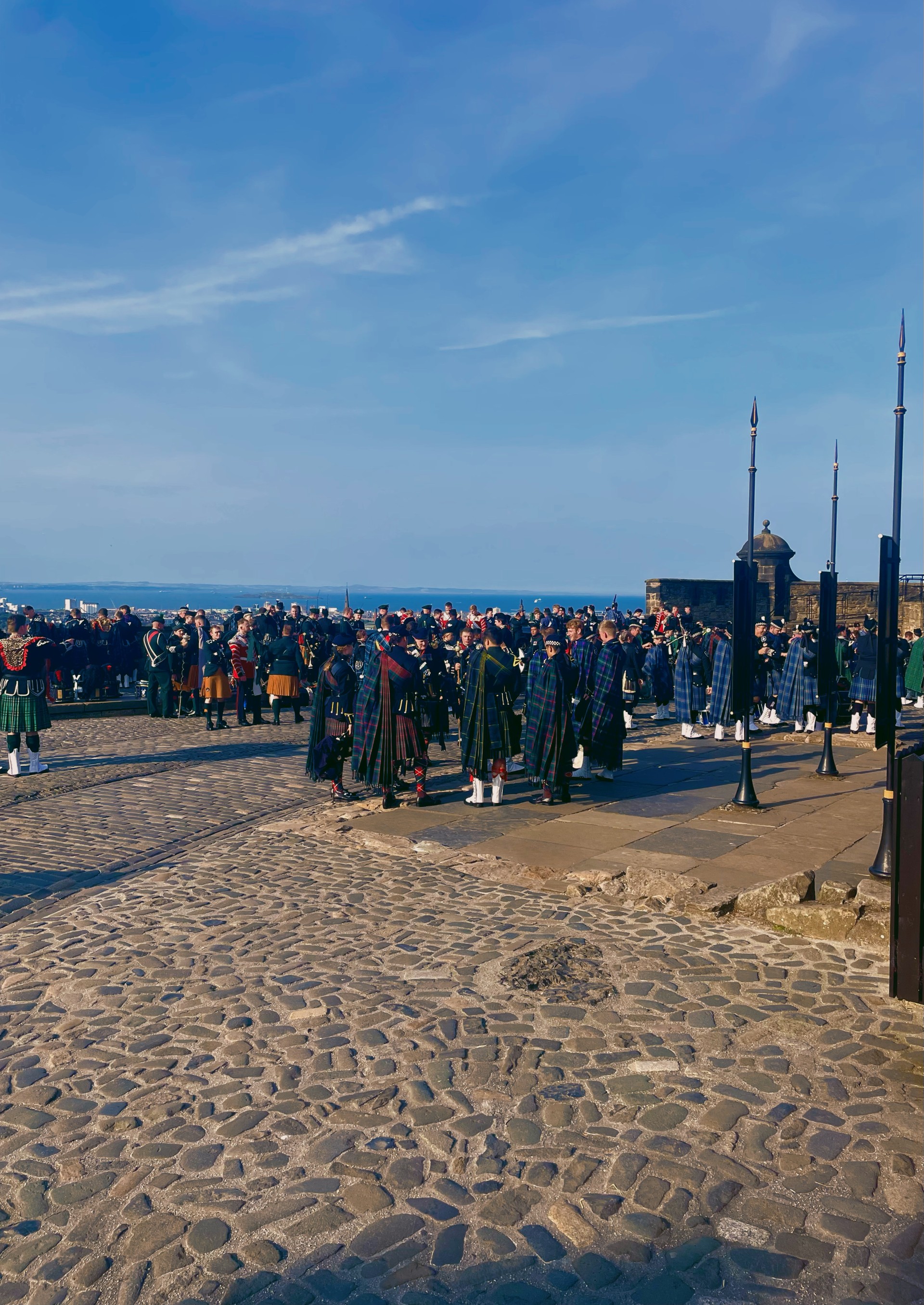 Felix Walker playing bagpipes with Edinburgh Castle in the background