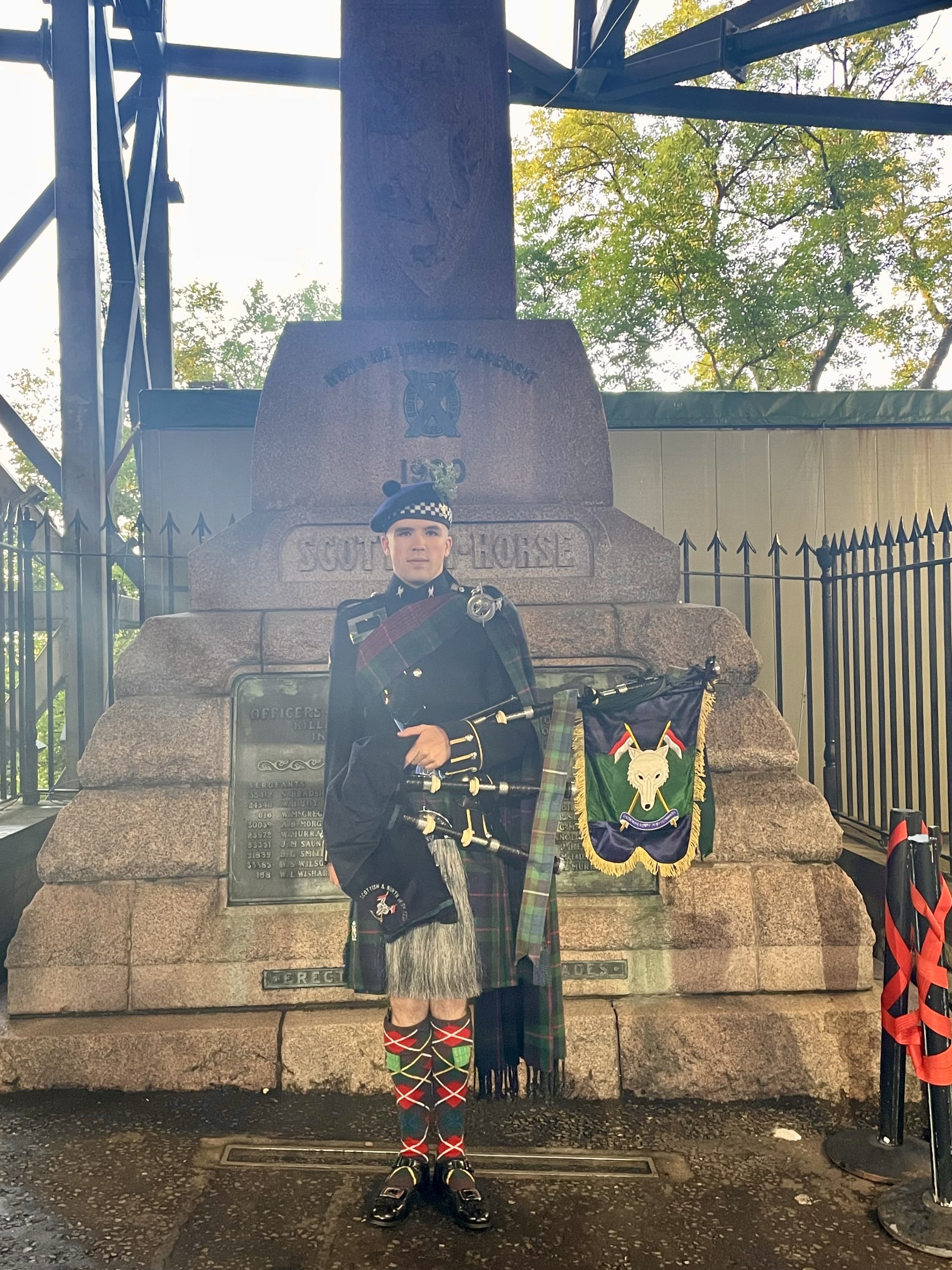 Felix Walker piping at the Scottish Horse war memorial